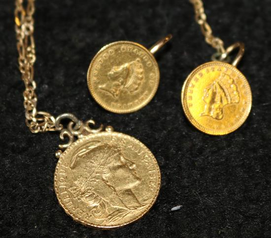 A gold 20 franc coin and a pair of gold 1 dollar earrings